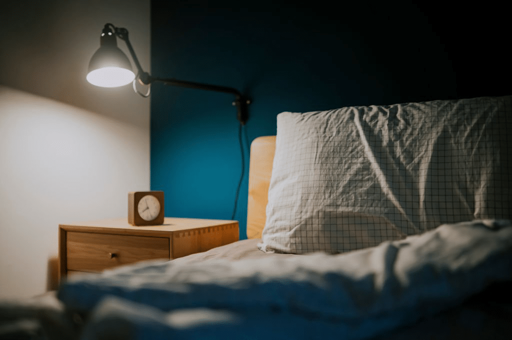Cosy bedroom at night- signifying quality sleep and rest. 