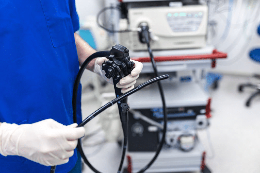 Nurse/doctor holding equipment for colonoscopy. Are colonoscopies painful? Debunking Gastroenterology Myths with Dr Jo-Hua Chen.