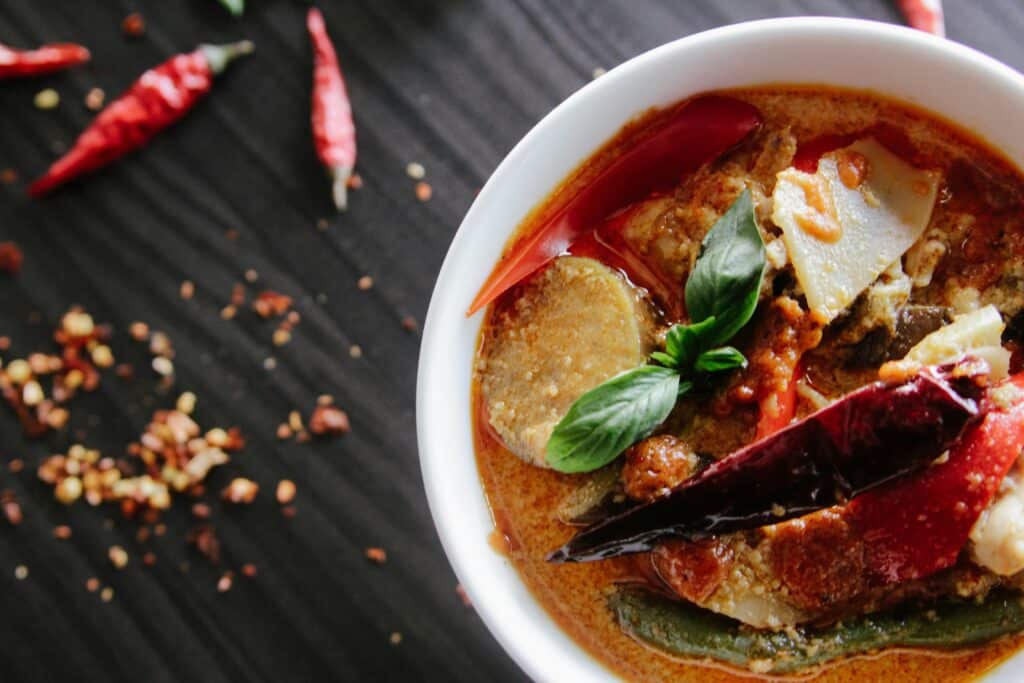 A bowl of spicy food- most probably curry. Are spicy food bad for gut health? Debunking Gastroenterology myths with Dr. Jo Chen.