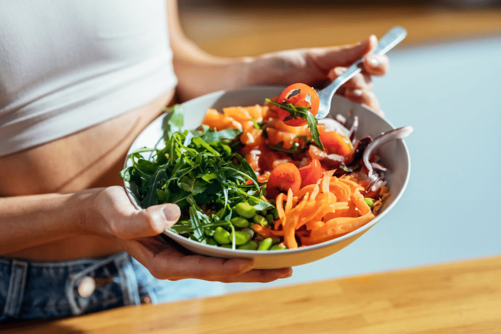 Eating a healthy bowl of salad for gut health. Gastroenterology services in West Ryde.